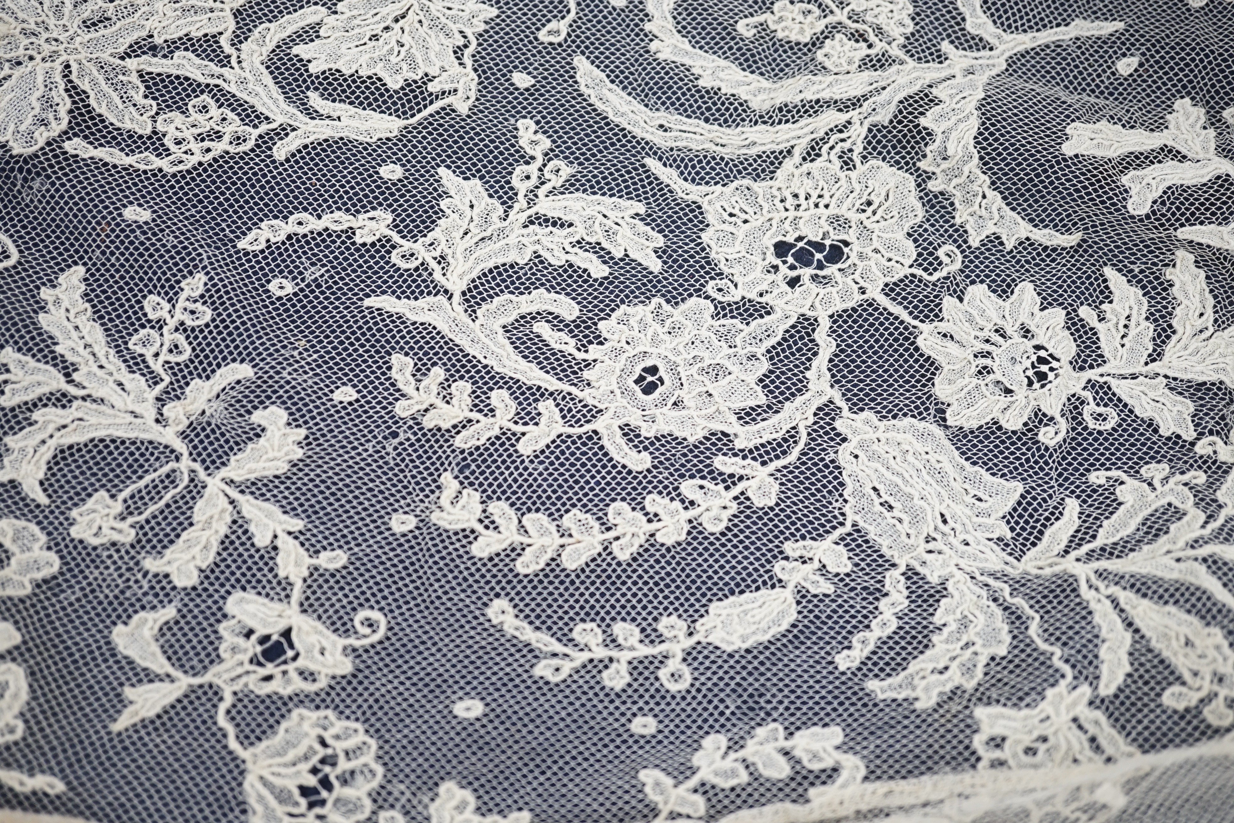 A rare length (9 and a half yards) of Brussels 19th century needle lace, some repairs and damage, circa 1880 and a similar wedding veil